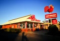 The front of Red Rooster is an Australian fast food restaurant chain founded in 1972 that specialises in roast chicken. Royalty Free Stock Photo